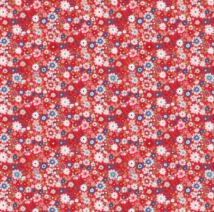 Floral pattern in reds blues and pinks with small flowers on a red background