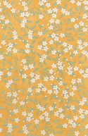Floral pattern with small beige white flowers on a bright yellow background