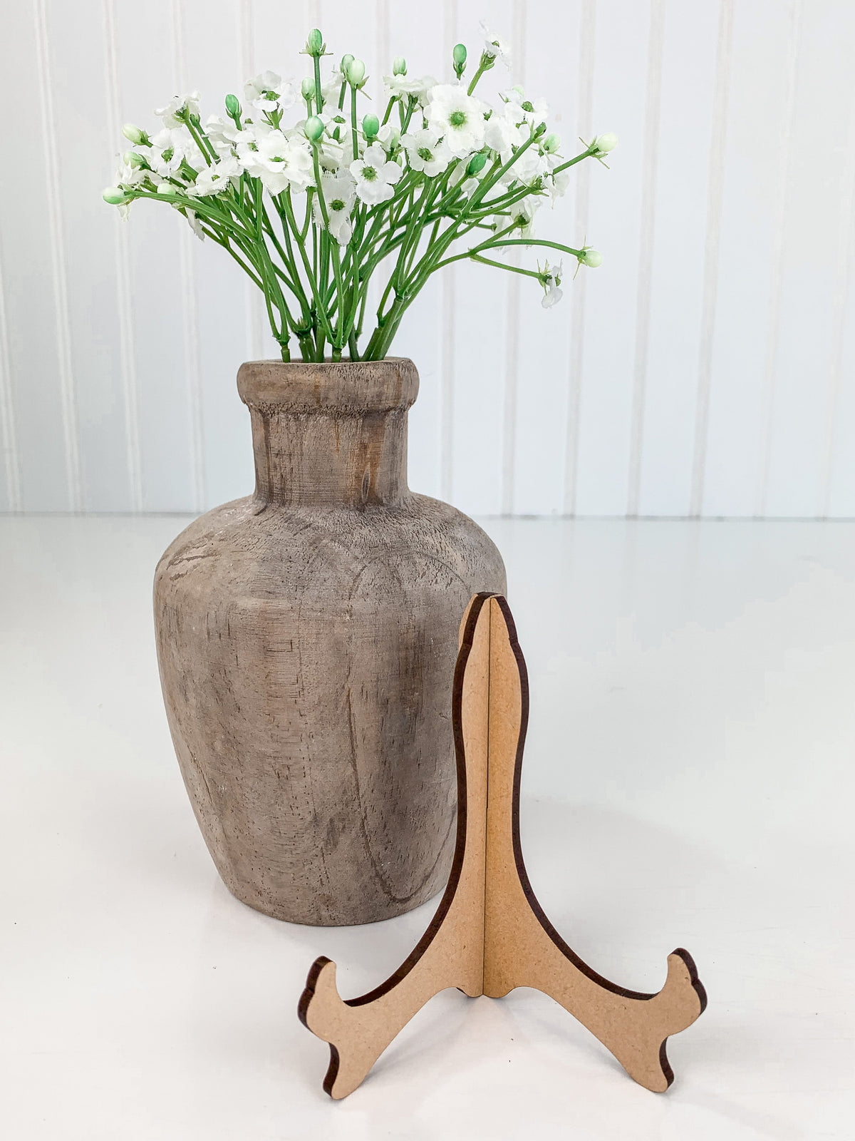 Small wood plate holder for displaying small signs.  For use with styling tiered trays, mantels, and shelves.