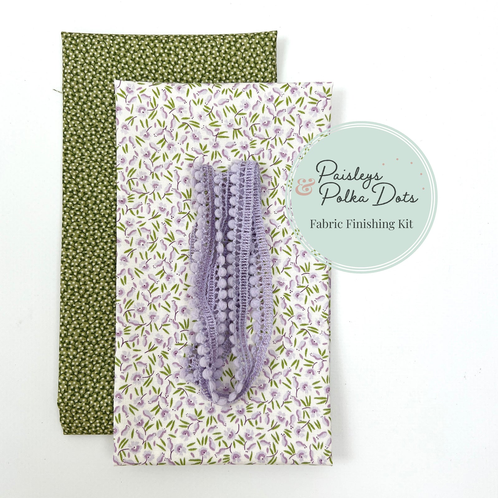 Cross stitch fabric finishing kit with green micro vine print and lavender mountain heather floral lavender pom-pom trim
