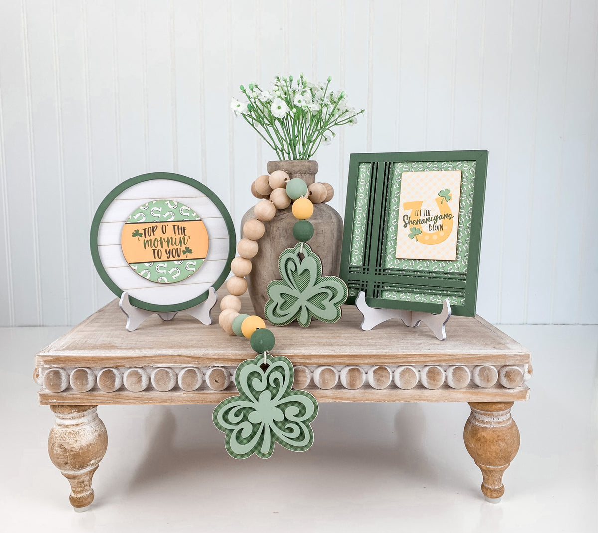 Small wood plate holder for displaying small signs. For use with styling tiered trays, mantels, and shelves. St Patrick&#39;s small wood signs. Top O&#39; the mornin to you. Let the Shenanigans begin sign.  Shamrock beaded garland