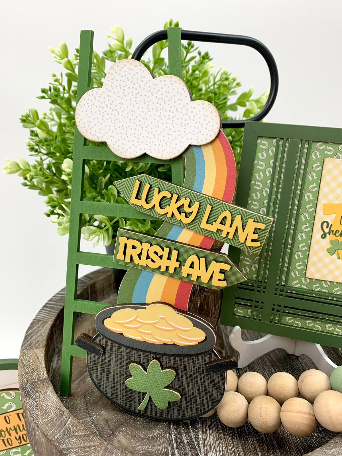 Wood St. Patick&#39;s Pot O&#39;Gold ladder with rainbow on tiered tray.