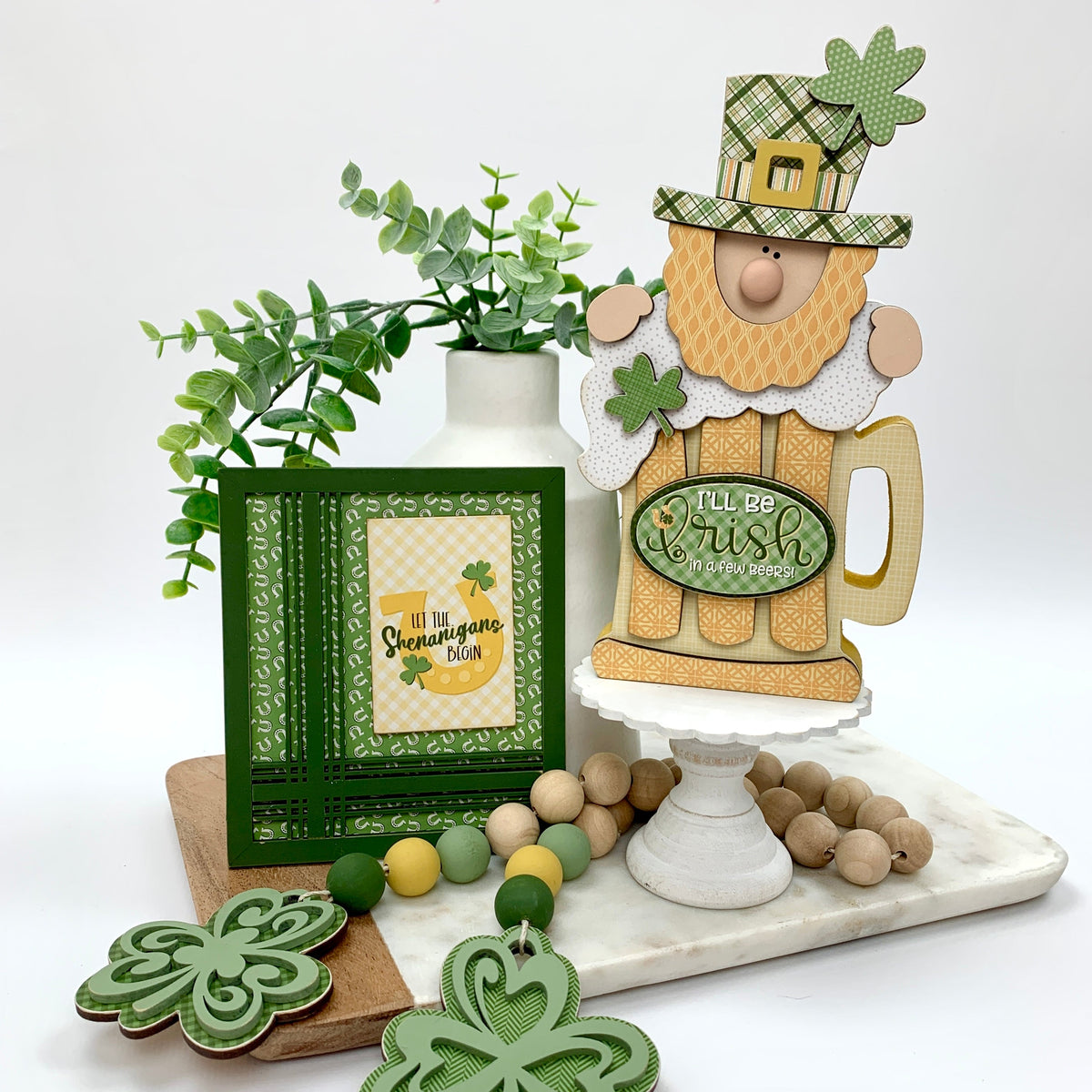 St Patrick&#39;s Leprechaun with beer and sign with the phrase let the shenanigans begin 