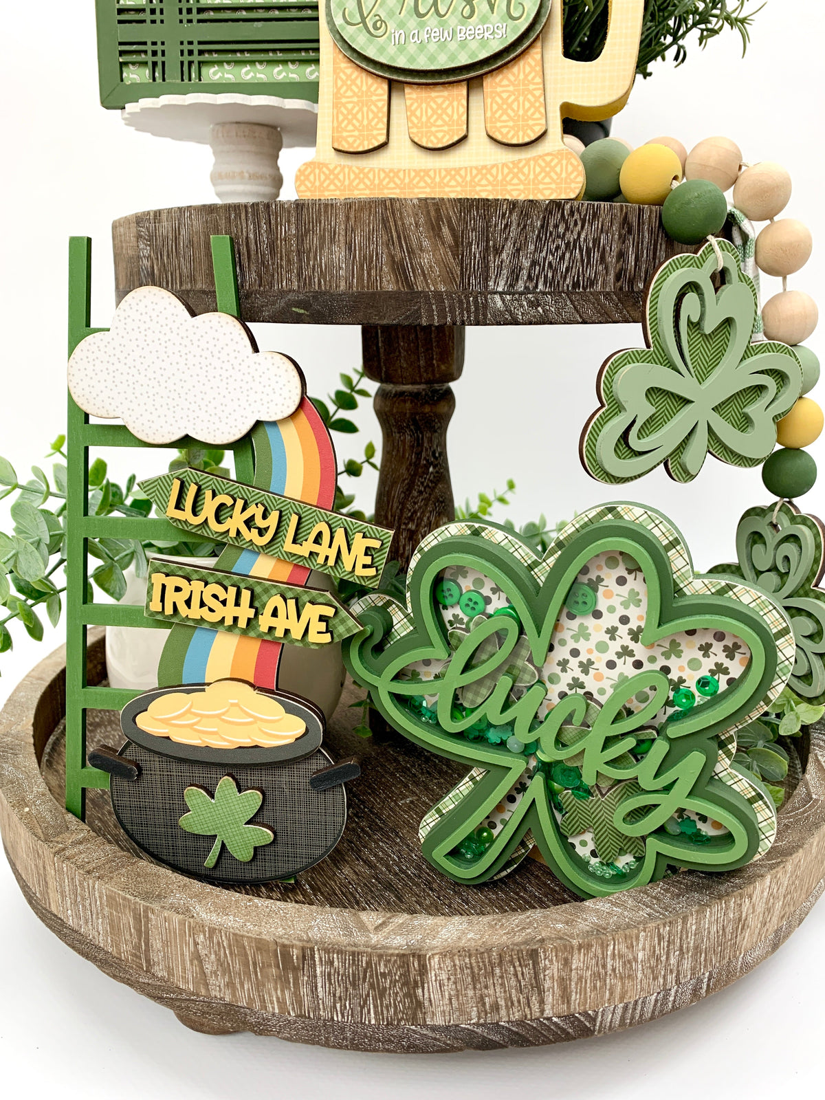 Wood St. Patick&#39;s Pot O&#39;Gold ladder with rainbow on tiered tray.