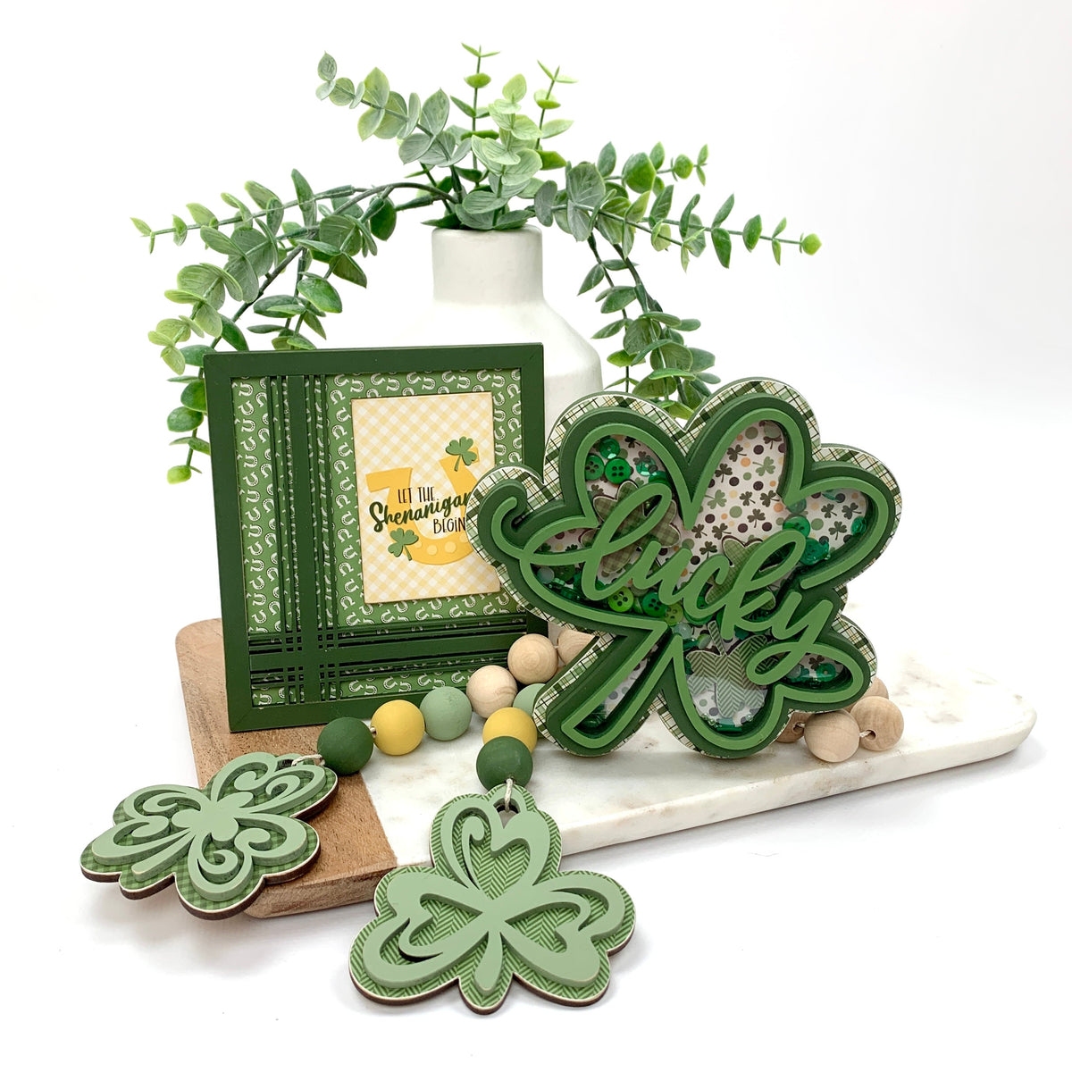 Wood decor St Patrick&#39;s shamrock shaker on tray with beaded shamrock garland.
