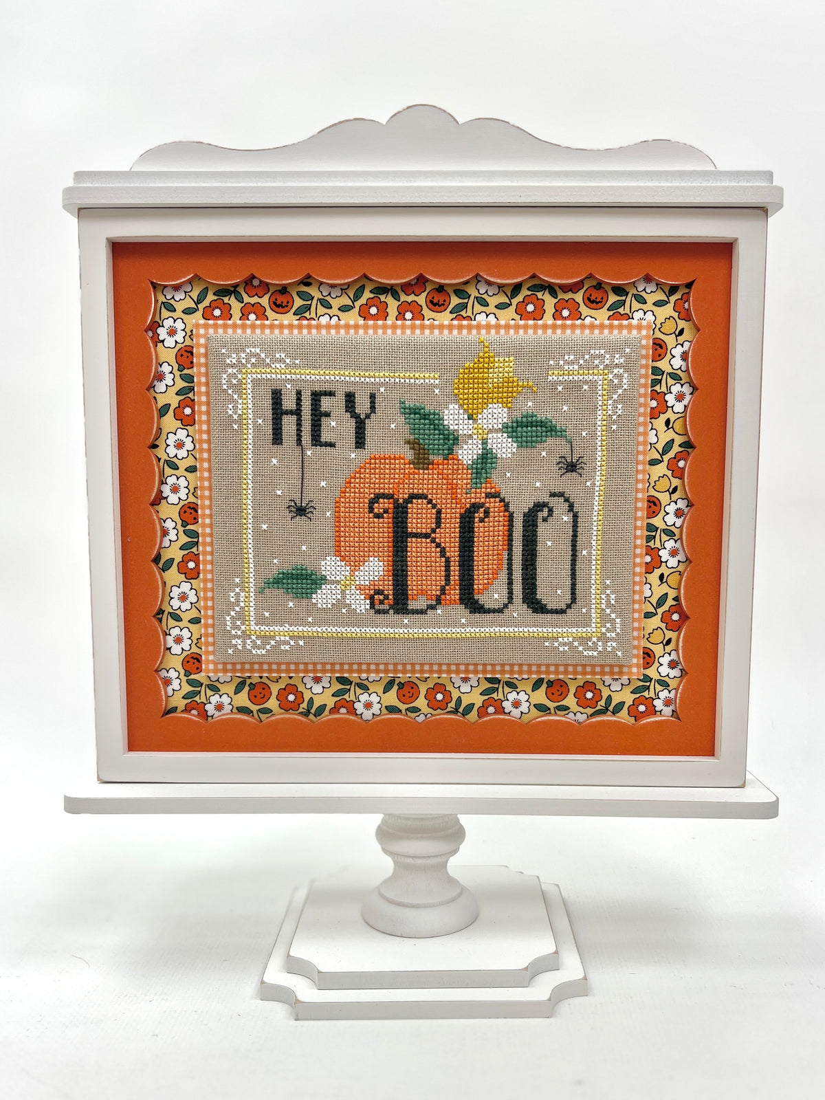 DIY wood cross stitch display frame with scalloped insert on pedestal; unfinished and paintable to match your stitch.