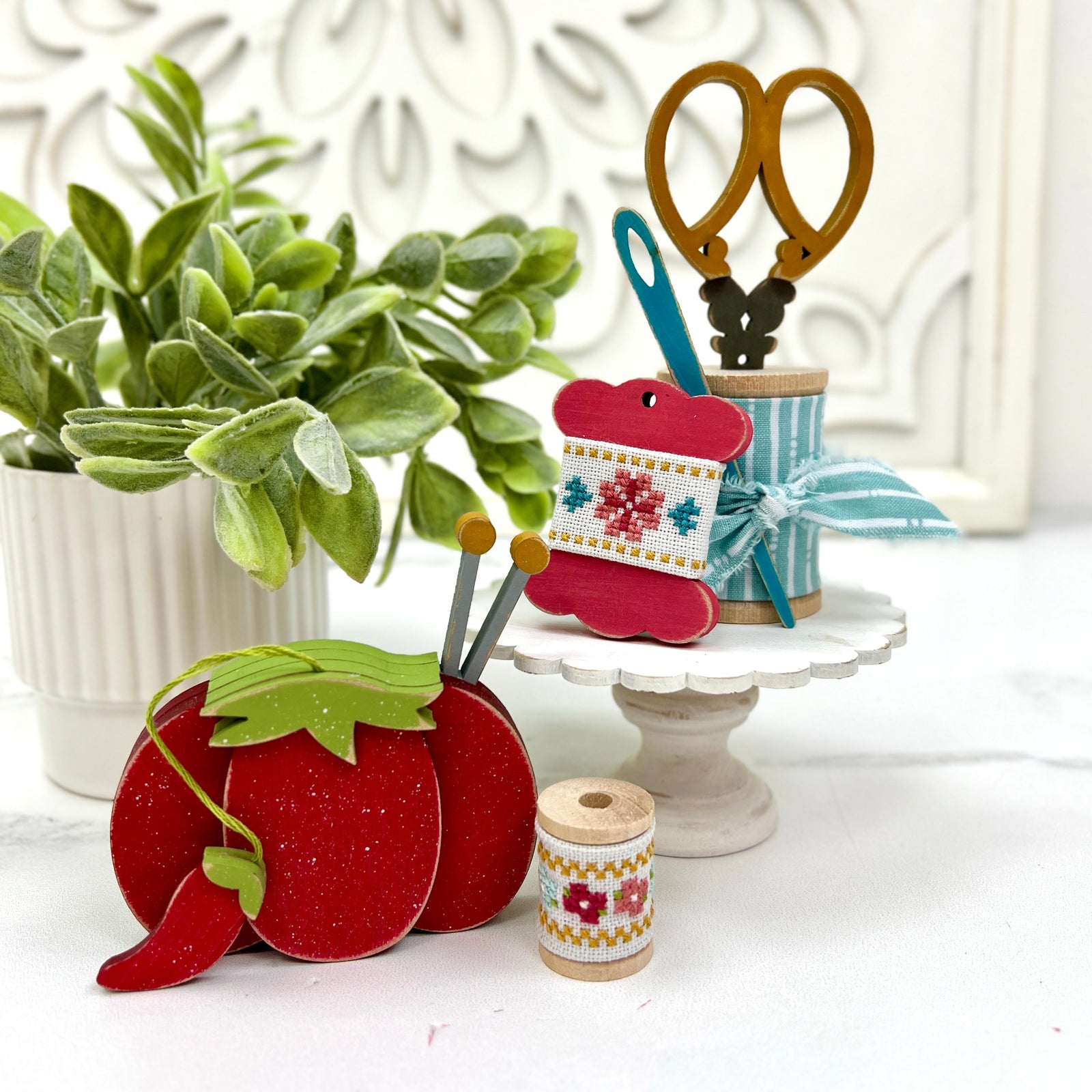 Wood craft shapes; tomato pin cushion, floss bobbin, wood spools, needle and scissors