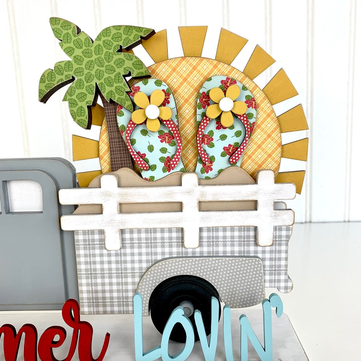 Wood pick up truck insert for summer. Summer Lovin phrase with a sun, palm tree, sand, and flip flops. Changing monthly or seasonally truck insert. 
