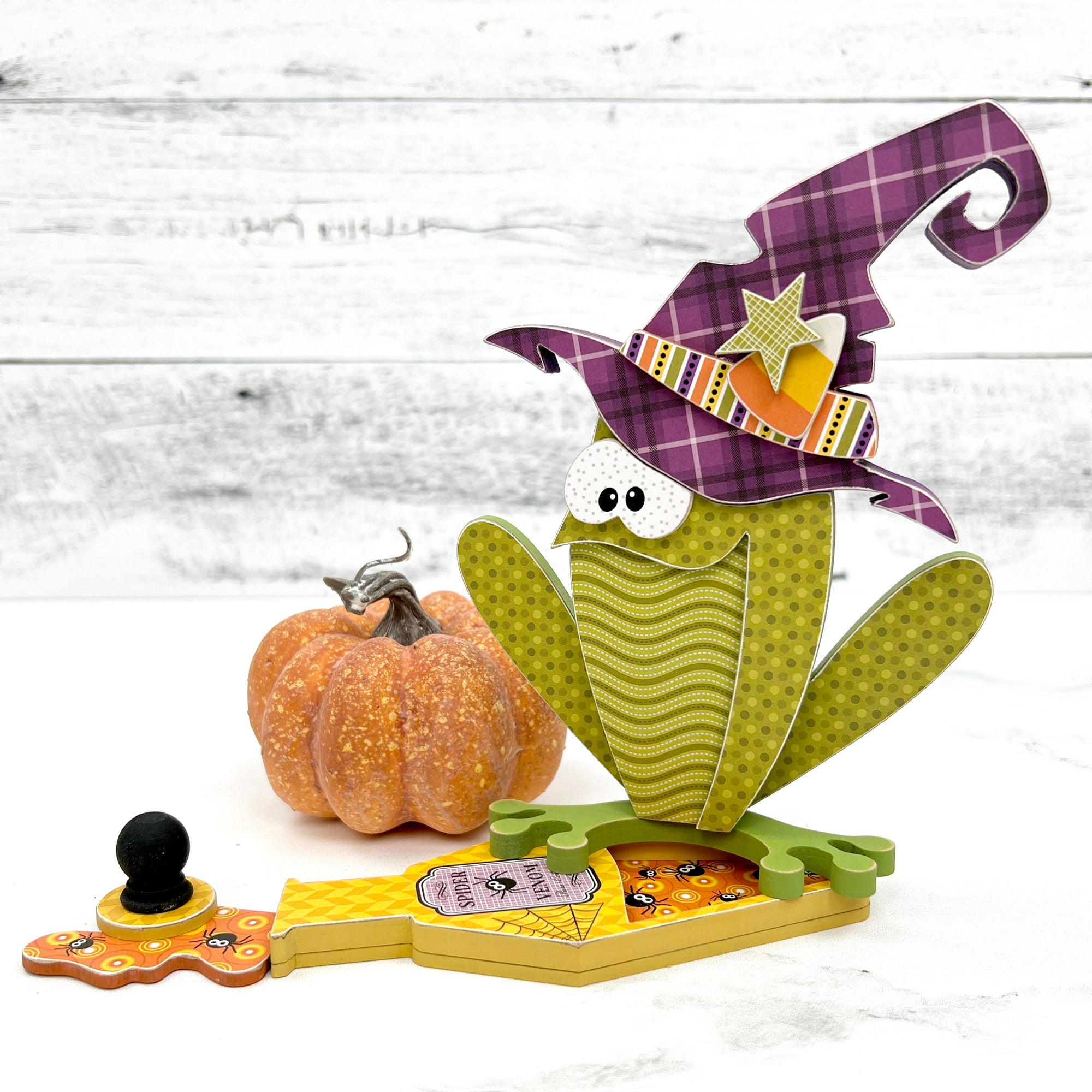 Halloween toad with a purple witch hat sitting on a potion bottle. Halloween wood decor DIY craft kit.