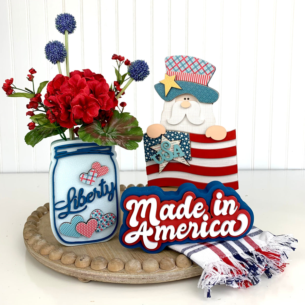 DIY 4th of July wood decoration kits on a wood tray.