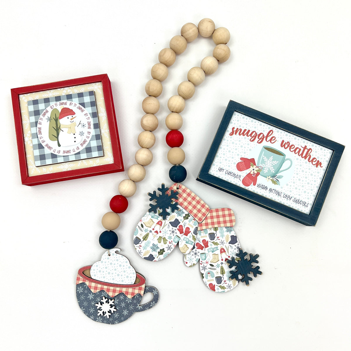 Winter signs that say snuggle weather and let it snow with wood beaded garland with mittens and cocoa cup 