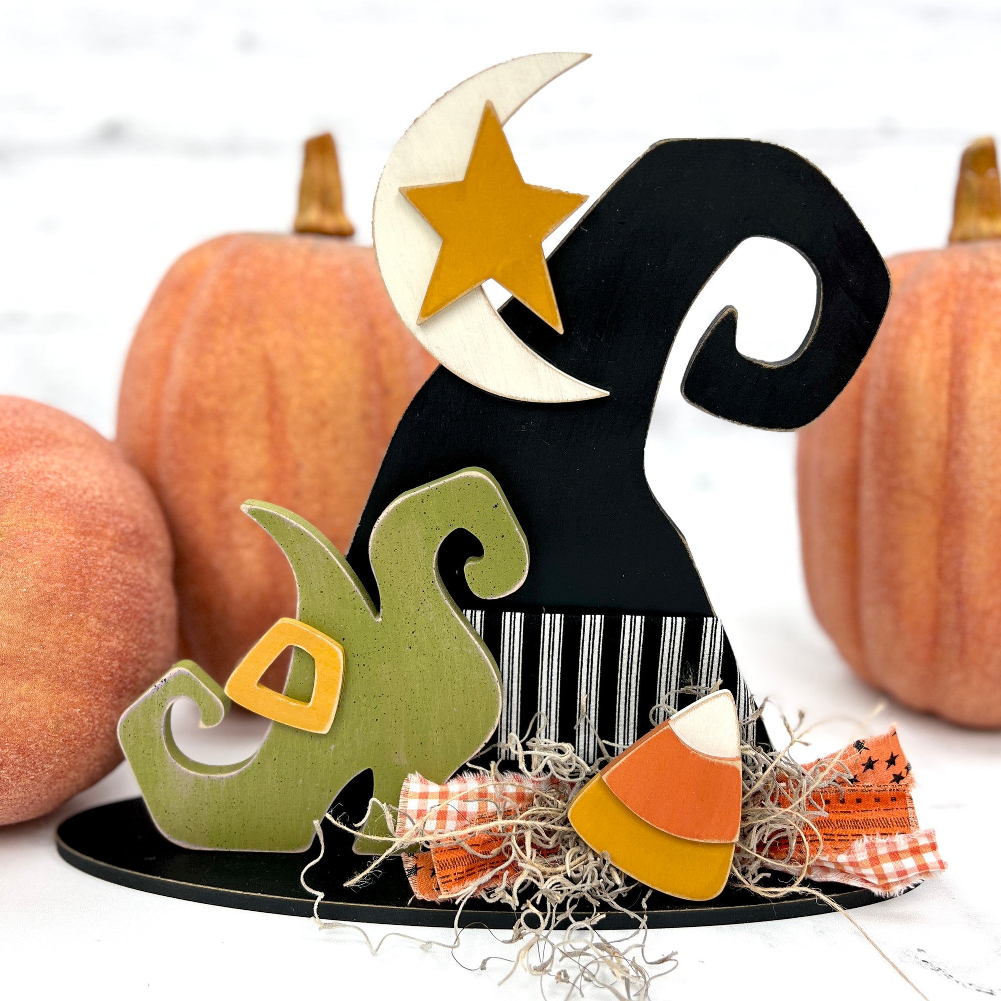 Witch hat halloween DIY wood craft kit with a green shoe, candy corn, moon and star.