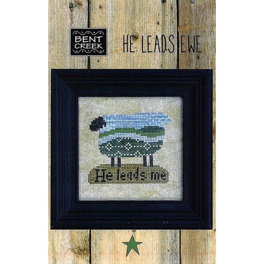 Cross-stitched pastoral sheep with He leads me text