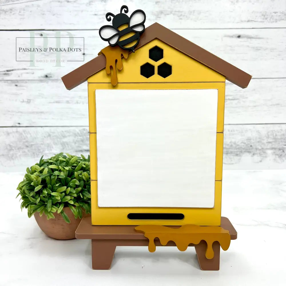 Bee house with roof and dripping honey. Wood Cross stitch display backer. 