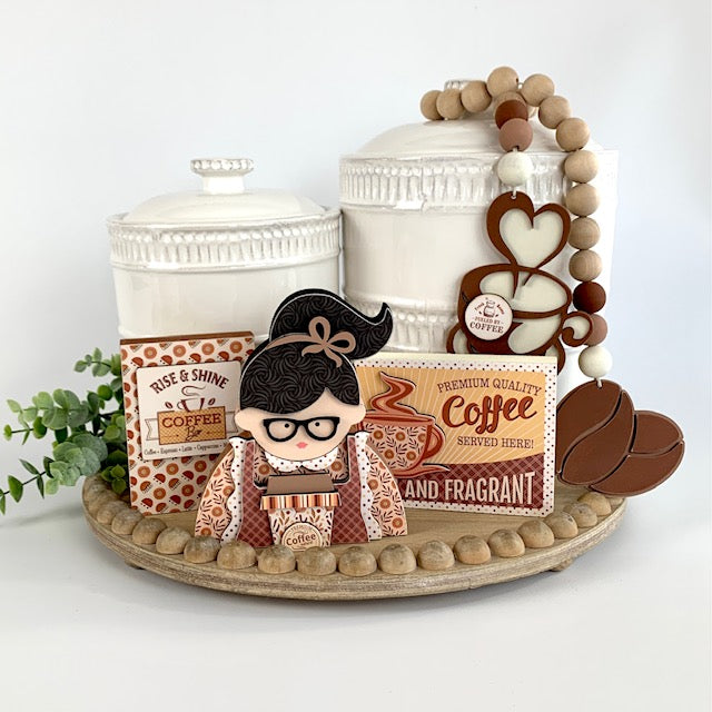 Coffee themed wood beaded garland with coffee beans and coffee cup. Two wood coffee signs for decorating trays, coffee bars, and coffee themed tiered trays. Coffee girl wood decoration.