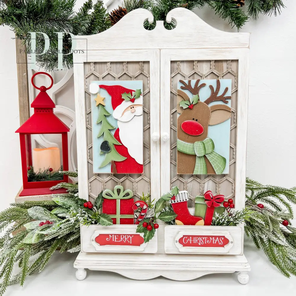 Country wood cabinet decor with santa and his reindeer peeking through the doors.  Wood craft kit.