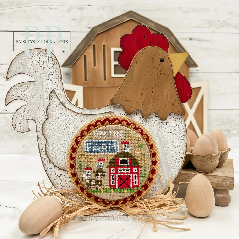 Country chicken wood cross stitch display with a finished cross stitch called on the farm by Stitching With The Housewives