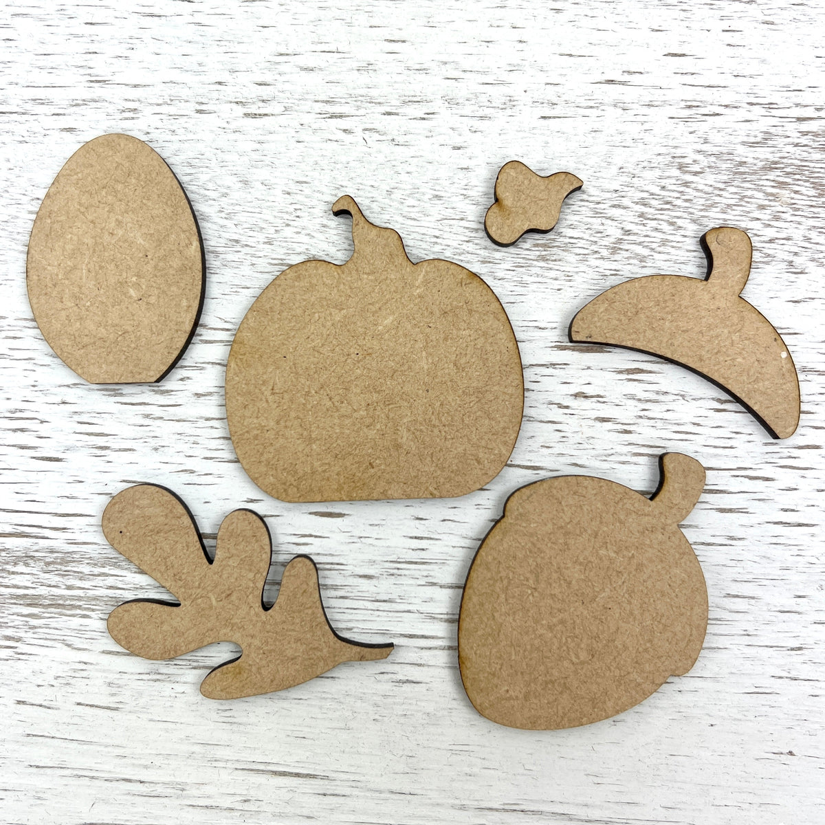 Wood fall shapes for cross stitch finishing; pumpkin, acorn, and leaf