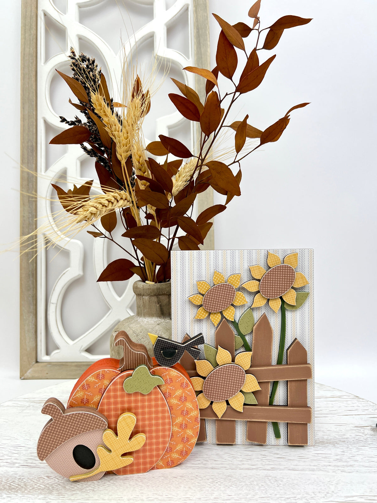 Fall pumpkin, sunflowers, picket fence, acorn, and crow wood decorations