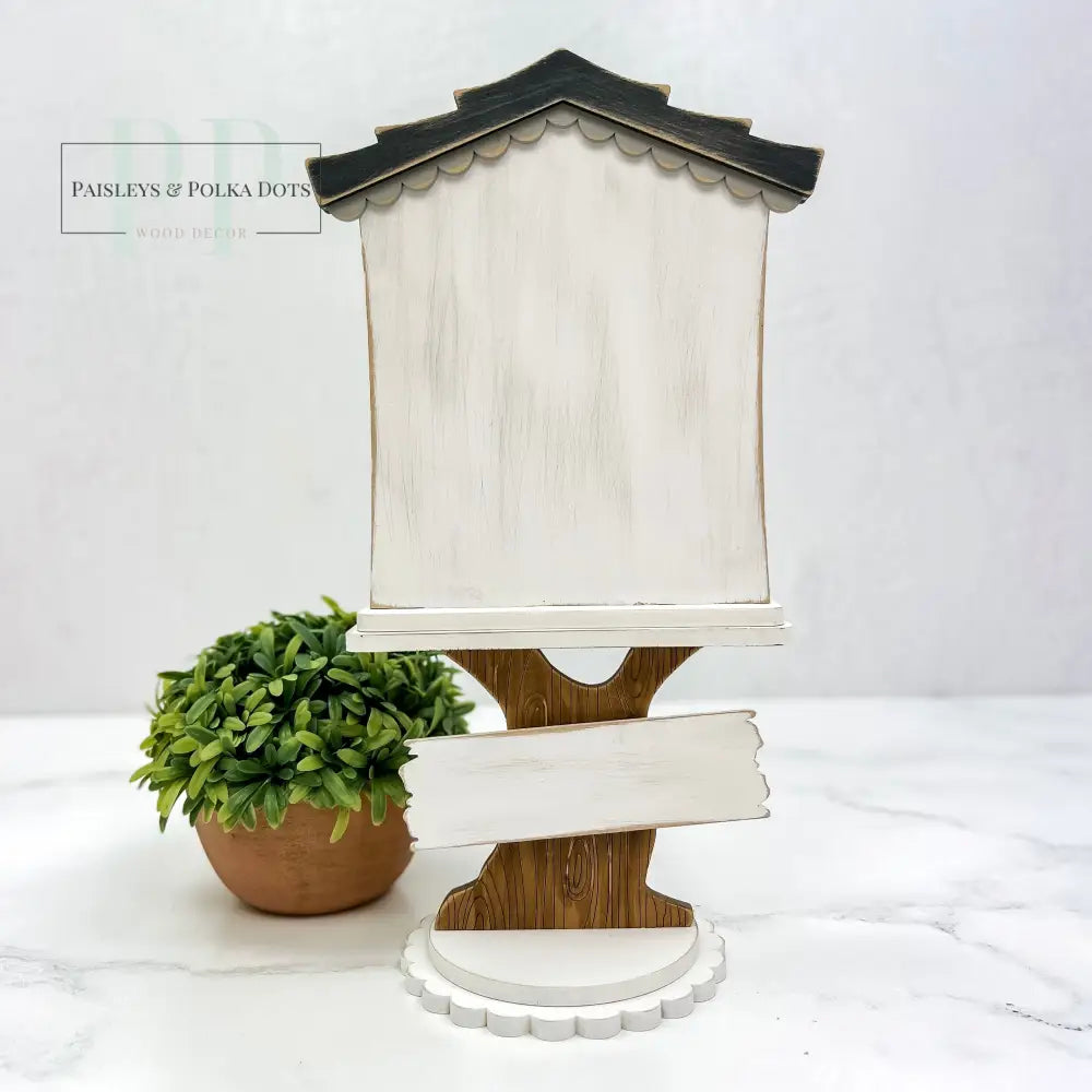 wood Cross Stitch Display shaped like a birdhouse with a tree base.