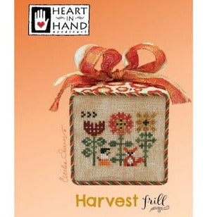 Cross-stitched trio of fall flowers design and a sly fox