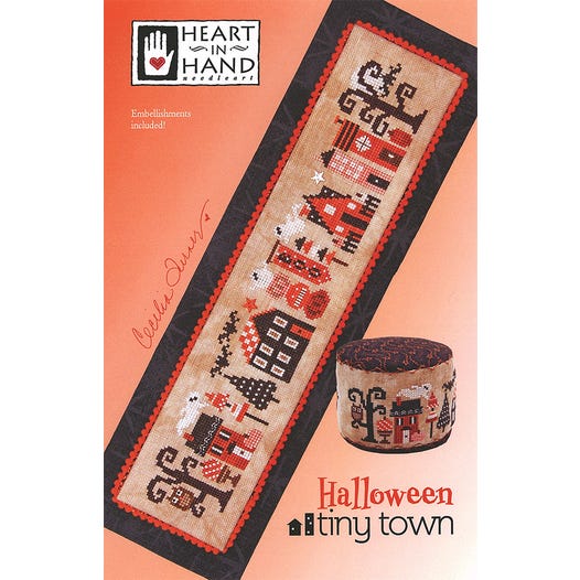 Spooky Halloween Village with friendly ghosts bats and a wise old owl