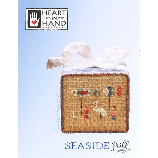 Seaside frill with beach clad children carrying fish kites with a crane and seagull