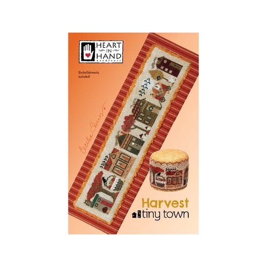 Harvest village cross stitch pattern with fall trees and bushels of apples and pumpkins