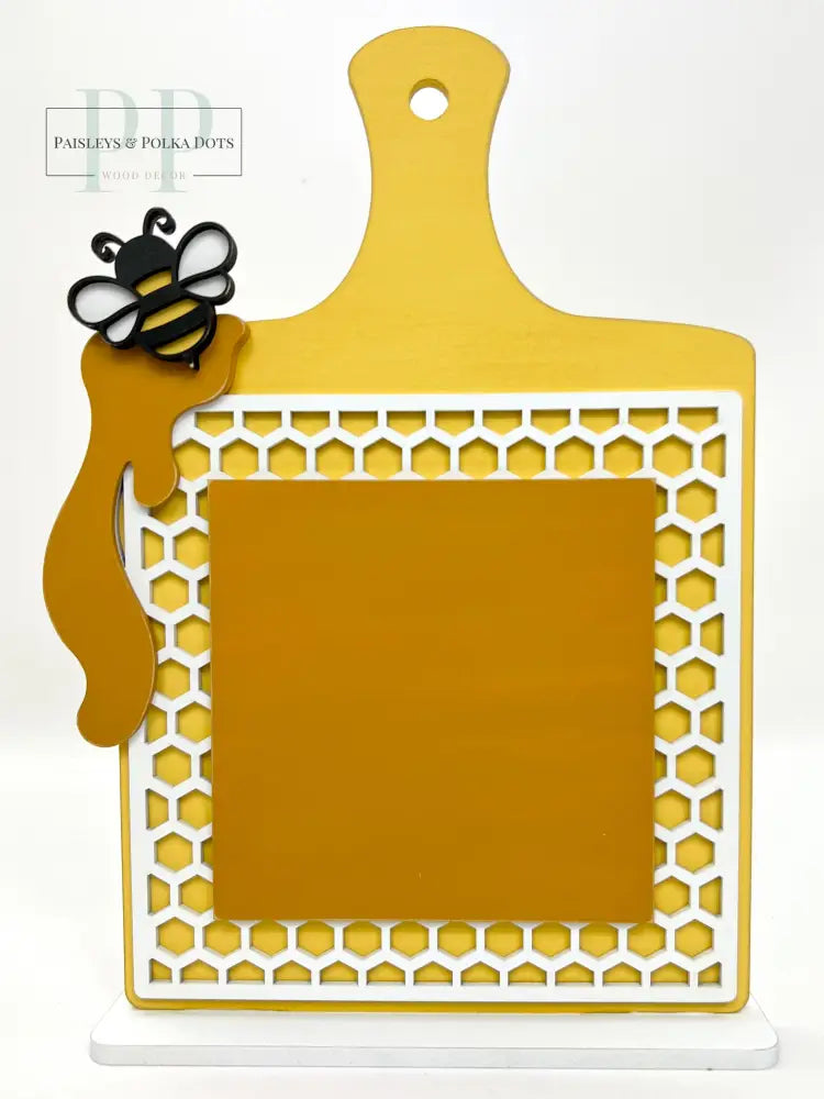 Wood recipe board with honeycomb, bumble bee, and dripping honey for cross stitch finishing and backing.