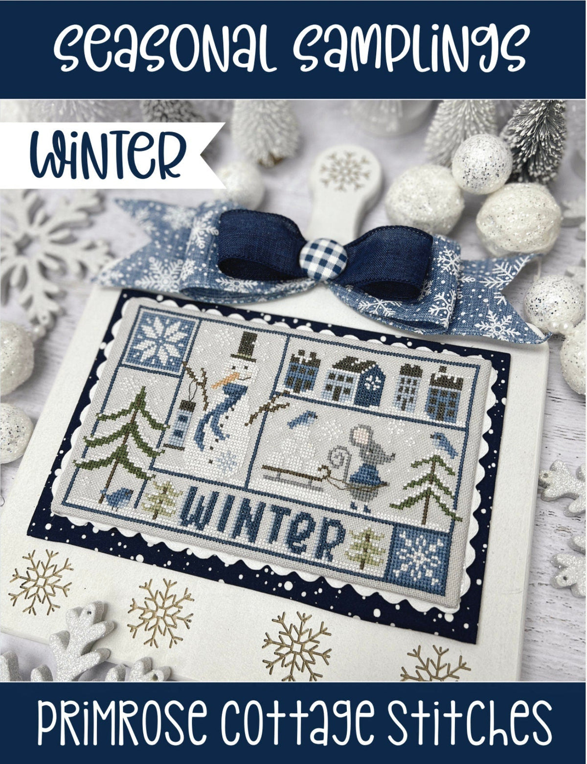 Cross-stitched design with winter-themed elements on a card, featuring snowflakes and a bow, with &#39;Primrose Cottage Stitches&#39; branding.