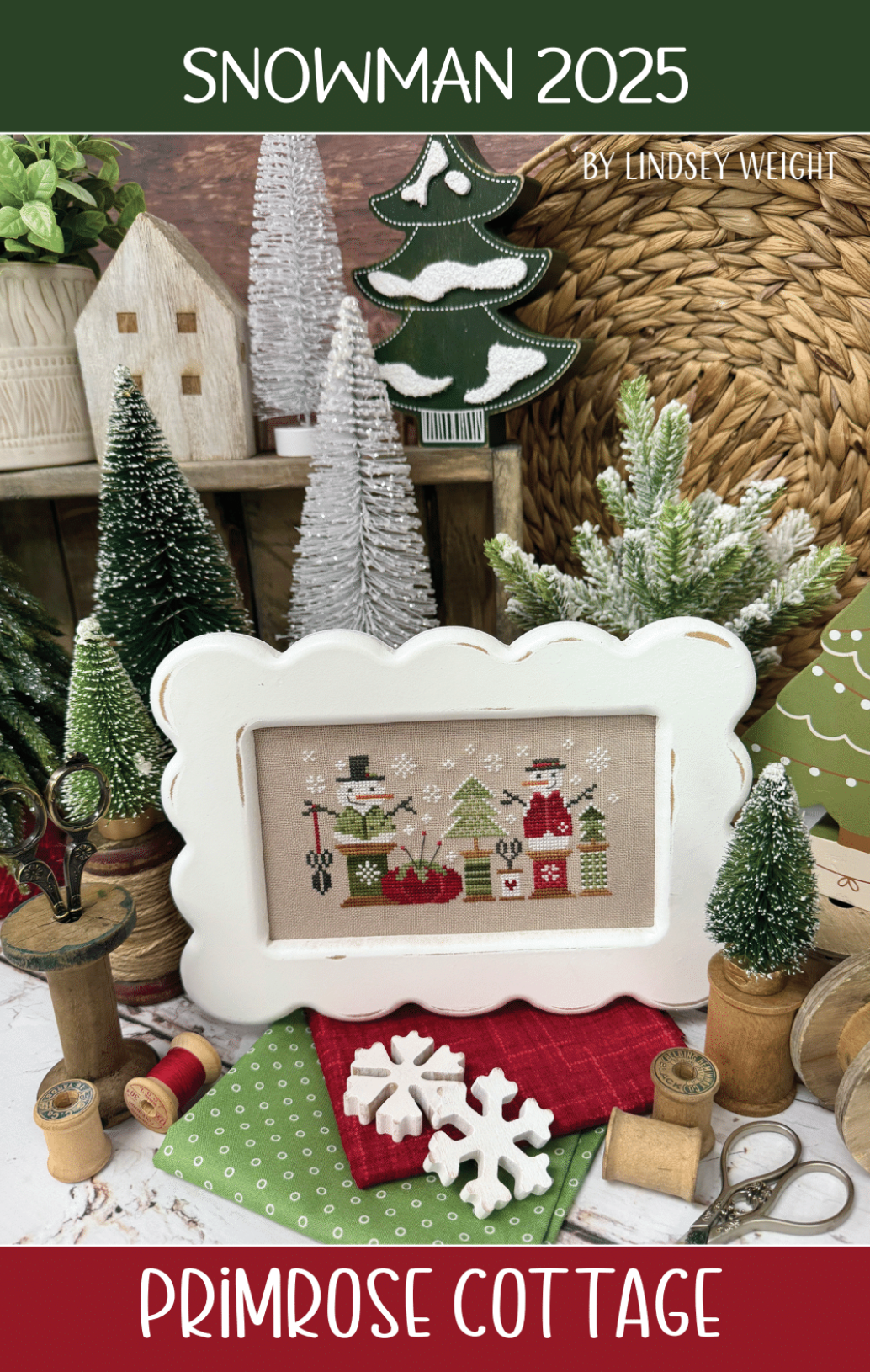 Decorative Christmas scene small trees, and festive snowmen and spools of thread.