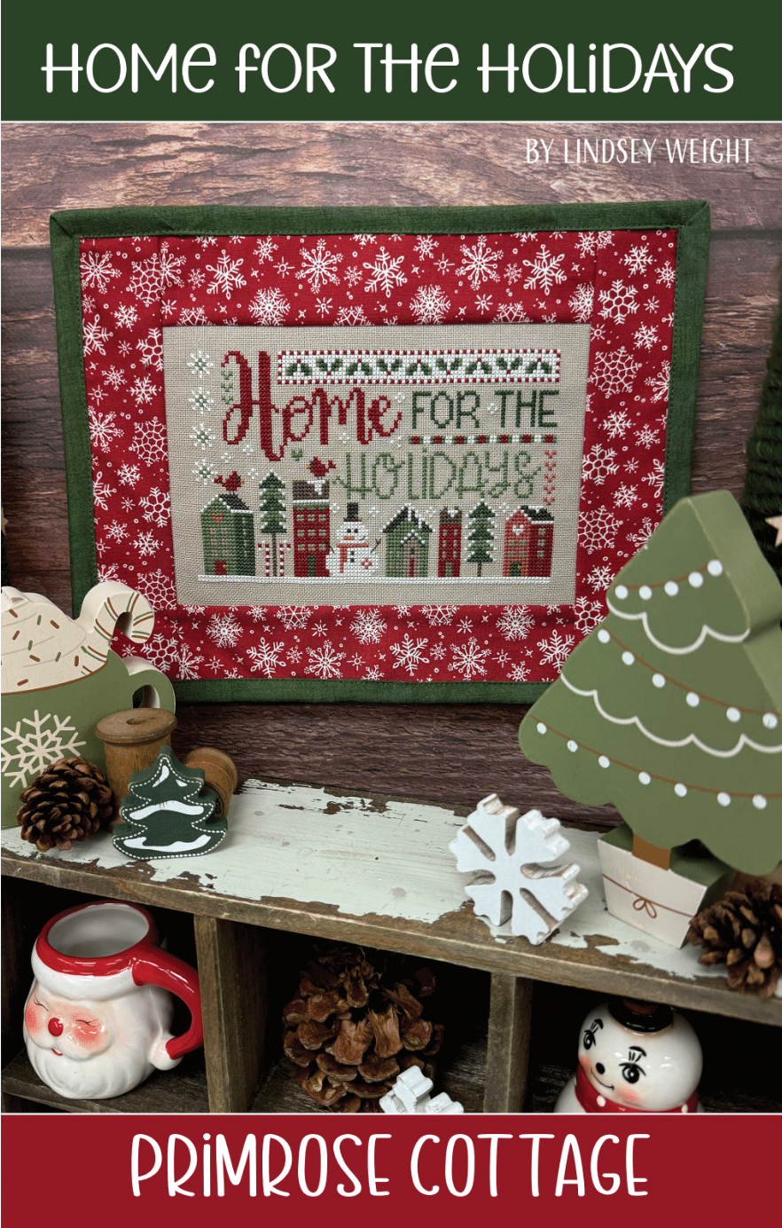 Cross-stitched design with 'Home for the Holidays' text with a winter scene of snowy houses and a charming snowman.