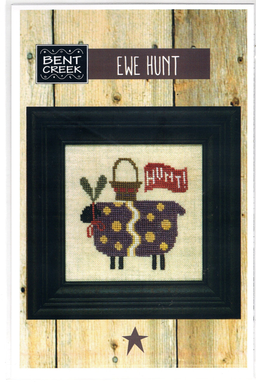 Cross-stitch pattern of a sheep with Easter bunny ears, a basket and 'Hunt' sign.