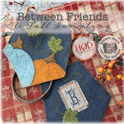 autumn-themed felt applique of pumpkins and alphabet initial monogram 