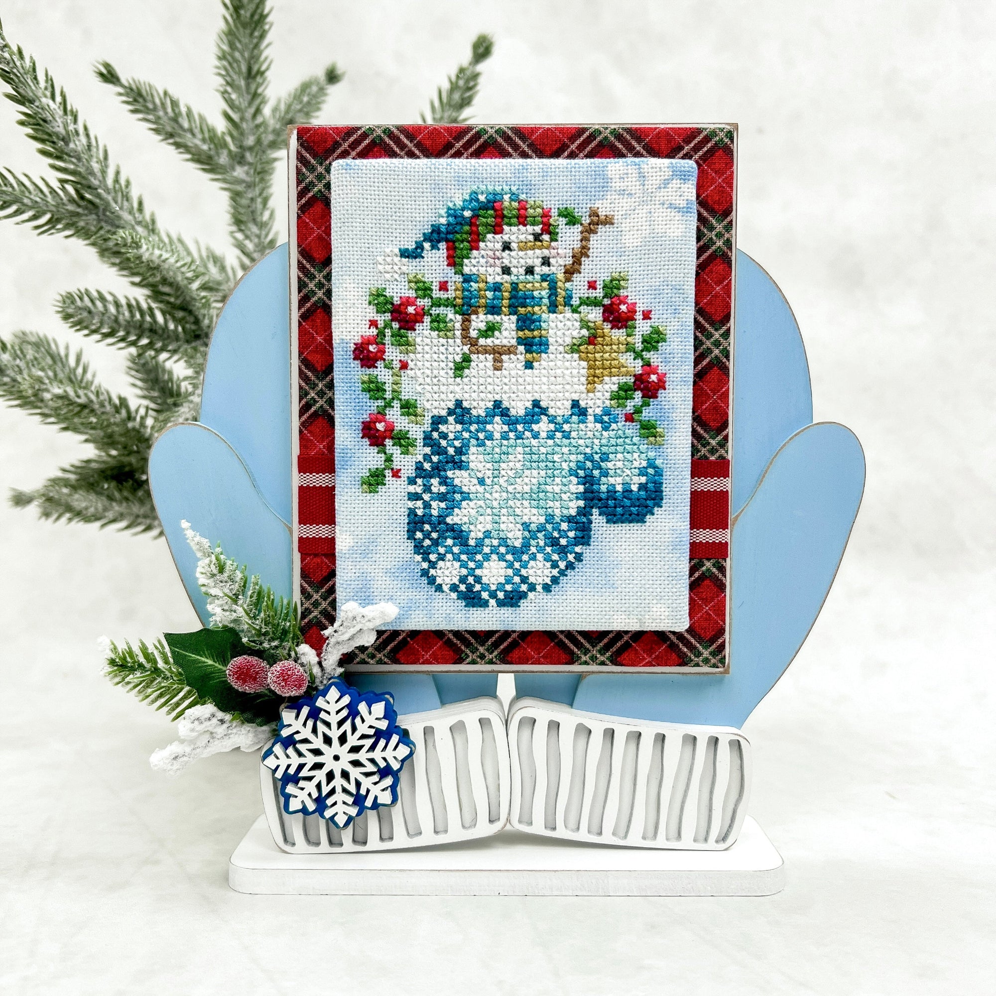 Blue cozy mittens wood cross stitch display with snowman cross stitch by Shannon Christine Designs