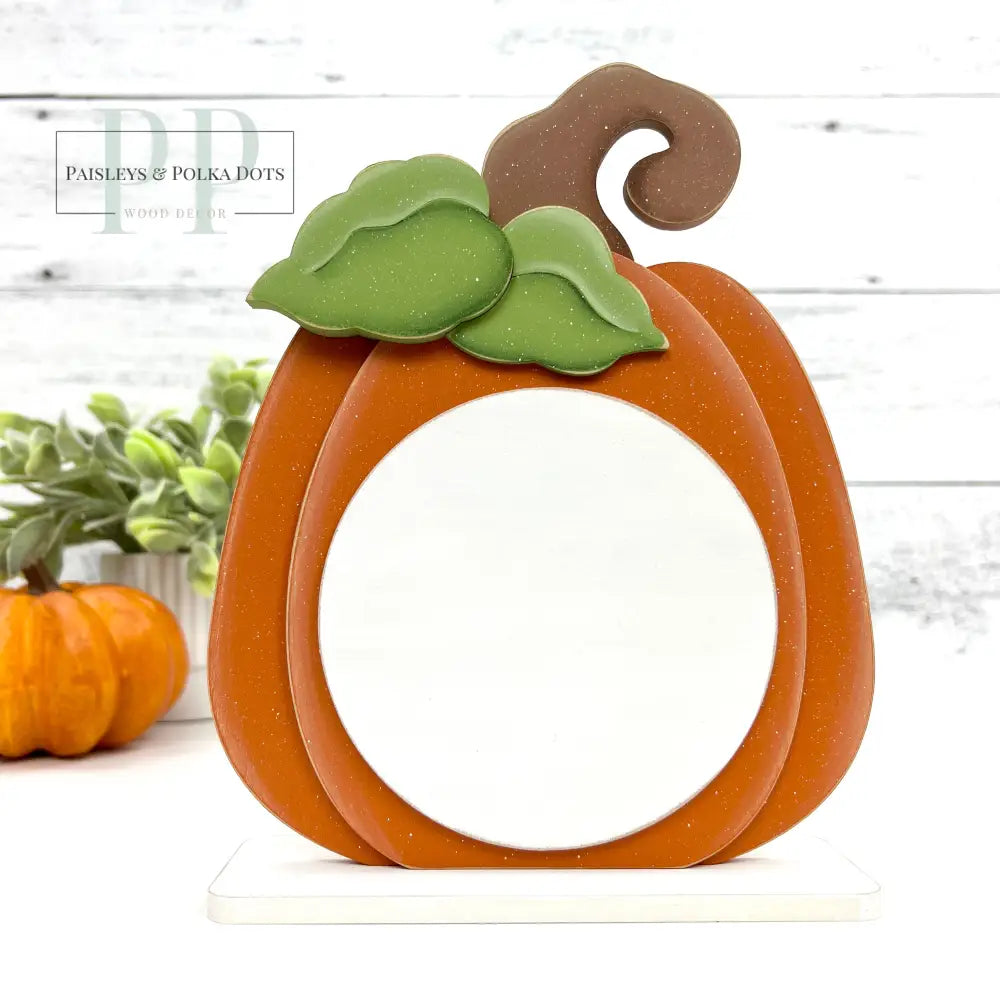 Orange pumpkin wood cross stitch backer display with green leaf and brown stem