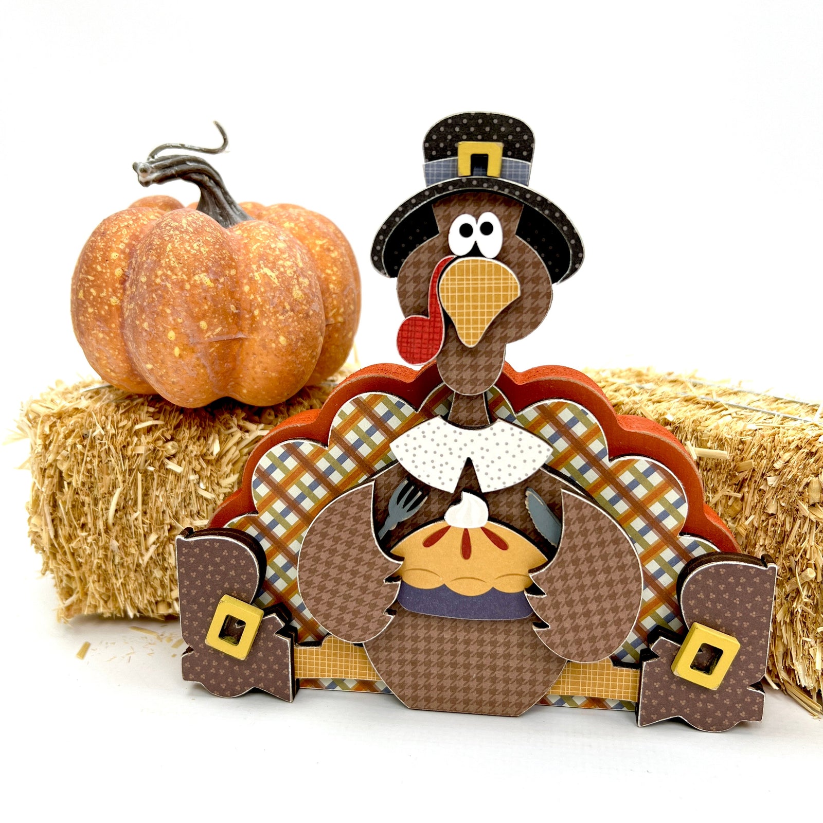 Turkey sitting down eating a pie wood decor crafting kit. 