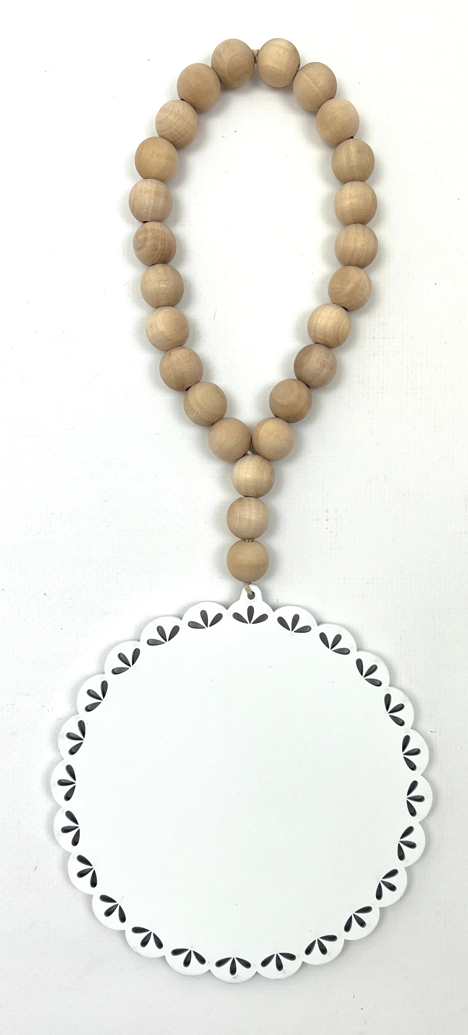 Round beaded hanging garland for cross stitch display backer.