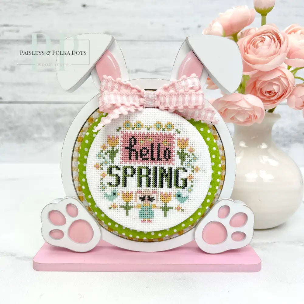 wood round bunny shaped cross stitch frame with a Stitching with the Housewives roundabout