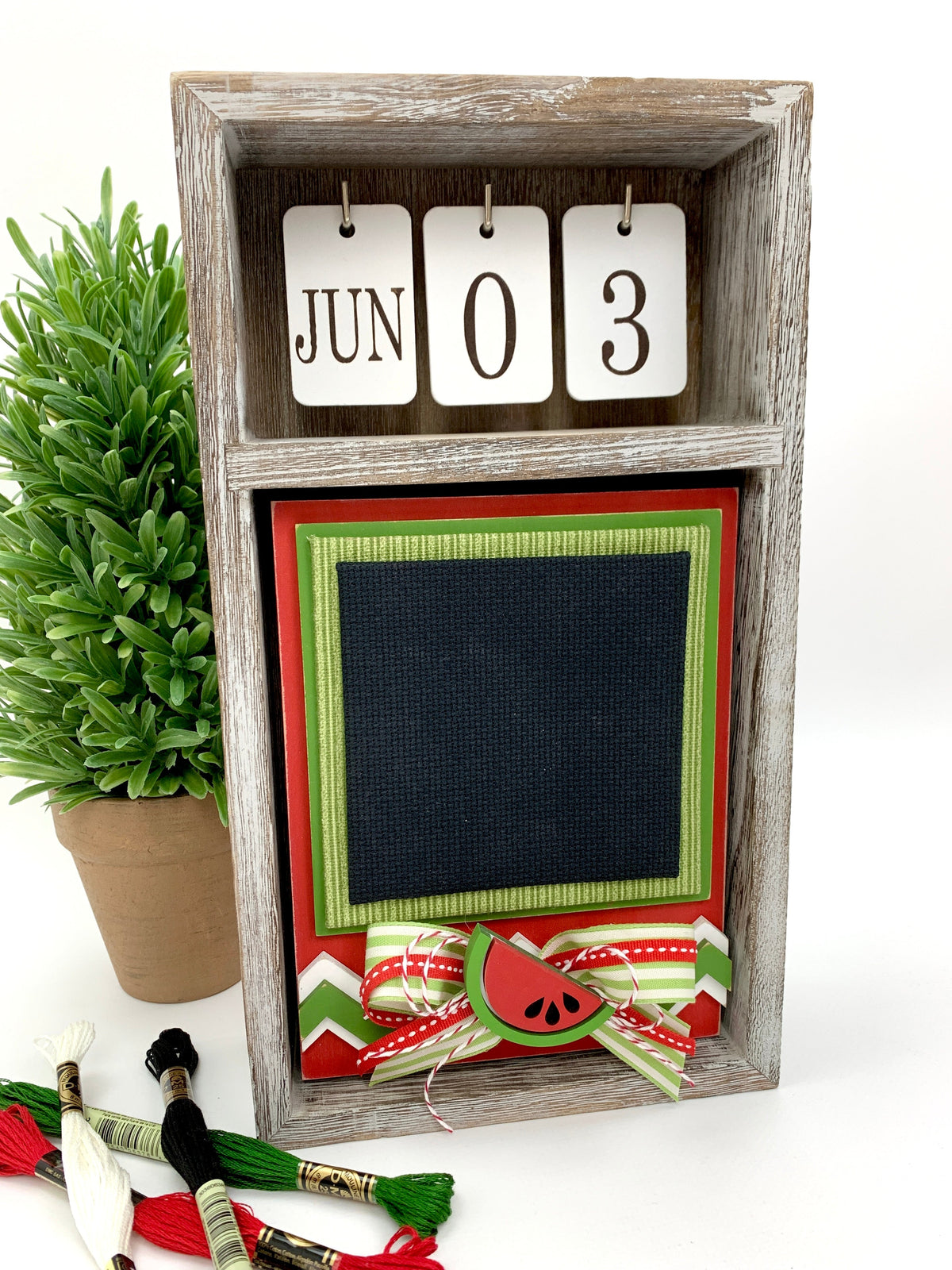 Watermelon cross stitch unfinished wood backer inside a seasonal calendar box