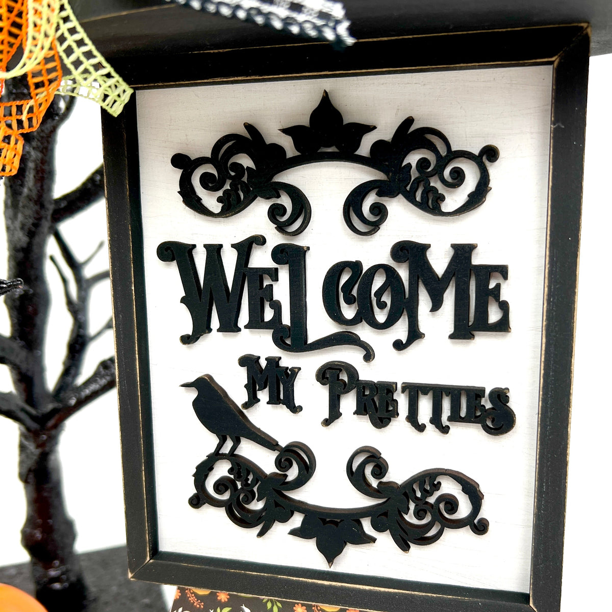 Welcome My Pretties witch wood Halloween decoration close up. 