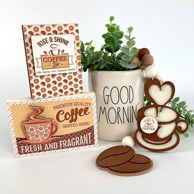 Coffee themed wood beaded garland with coffee beans and coffee cup.  Two wood coffee signs for decorating trays, coffee bars, and coffee themed tiered trays. 