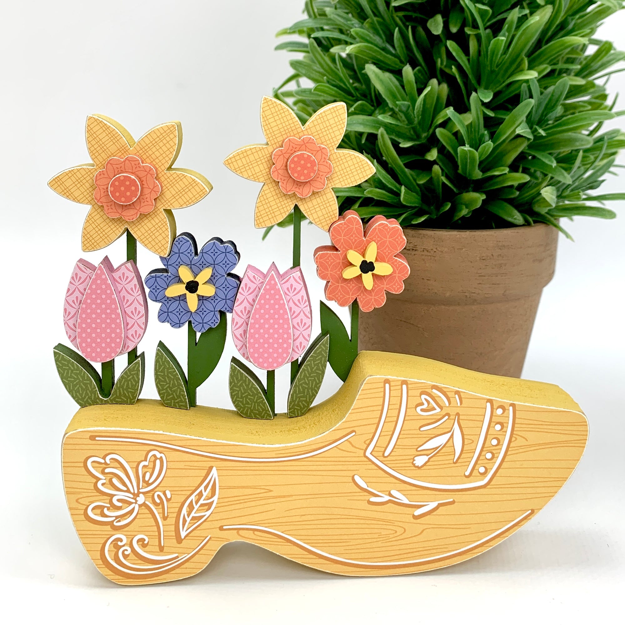 Wood decoration Dutch spring clog with pink tulips, yellow daffodils, and blue flowers