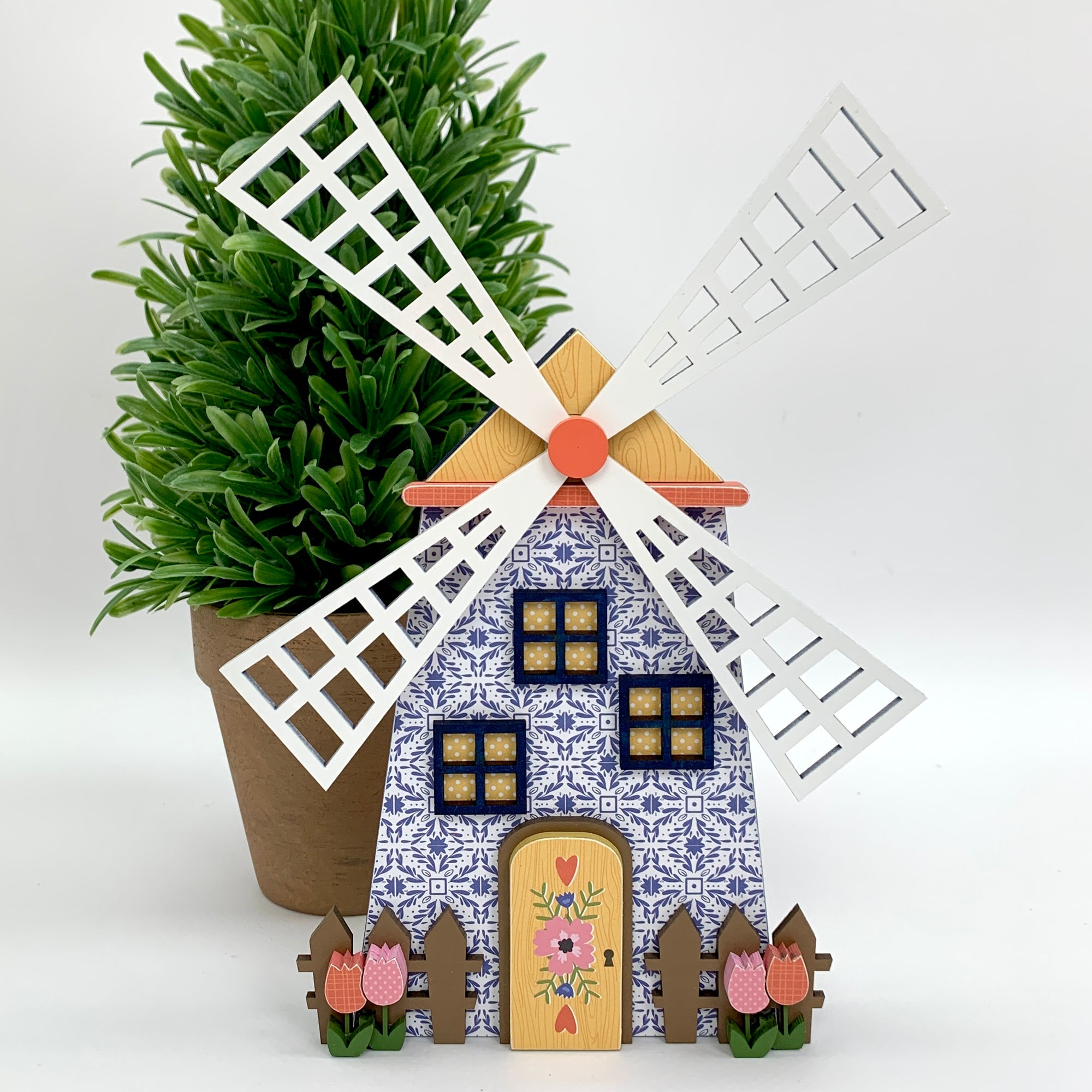 Dutch Spring windmill wood decoration with picket fence and tulips.