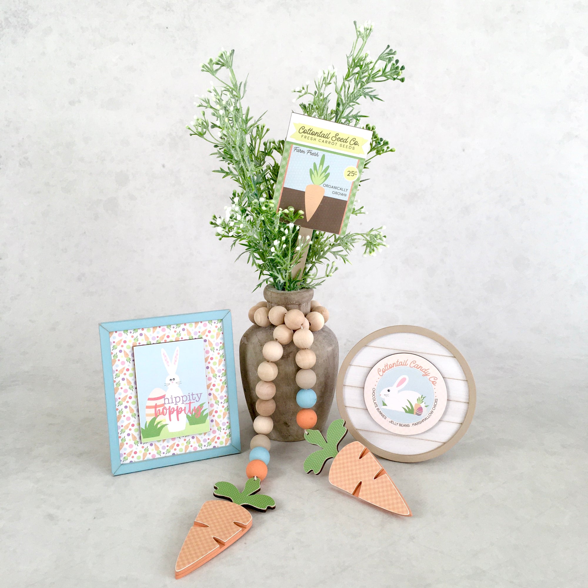 Easter tiered tray signs, easter beaded garland, shiplap signs, carrot garland with beads, seed packet plant stick, easter tiered tray decor, small wood signs for tiered trays. Easter tiered tray ideas.
