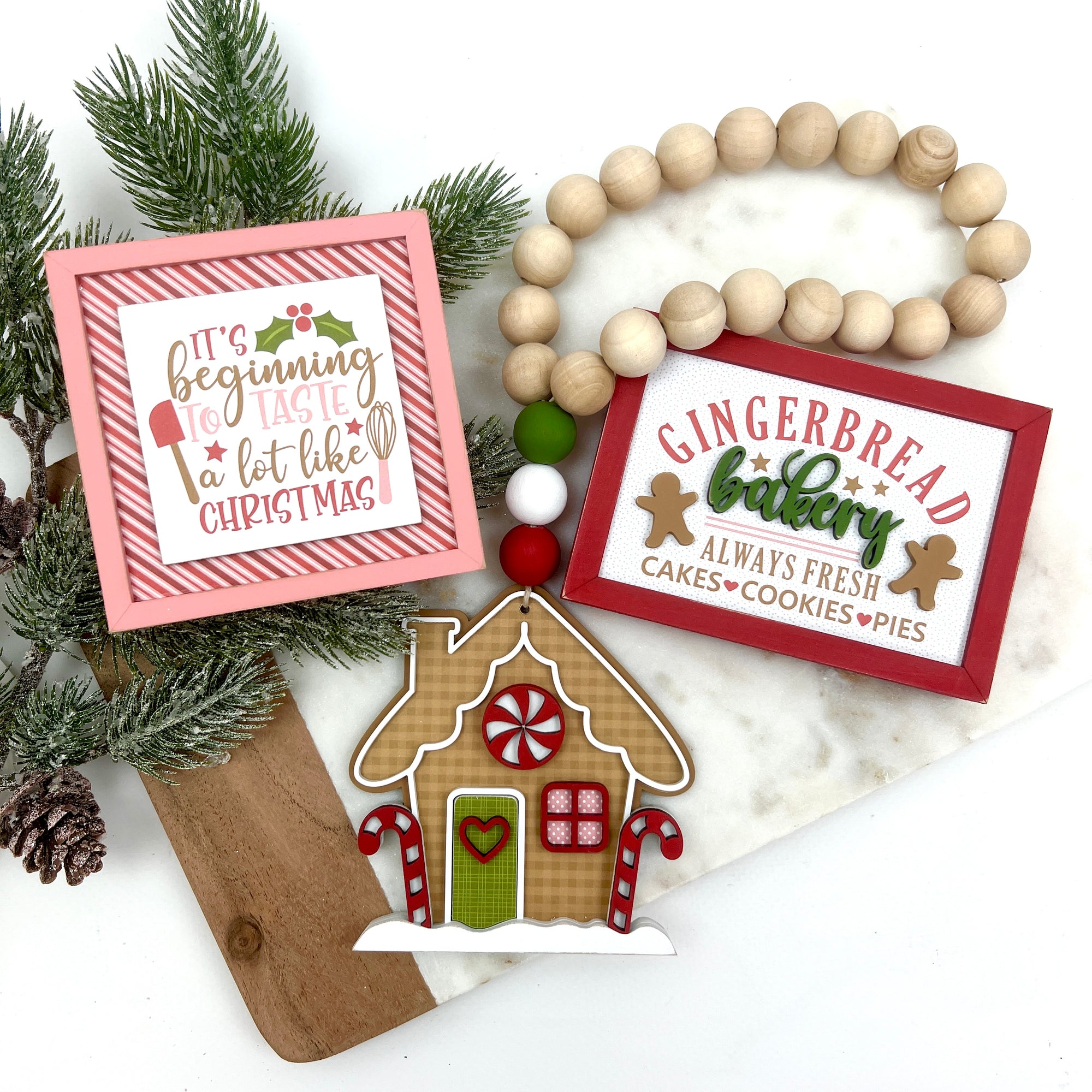 Christmas gingerbread tiered tray signs, and gingerbread house wood beaded garland.