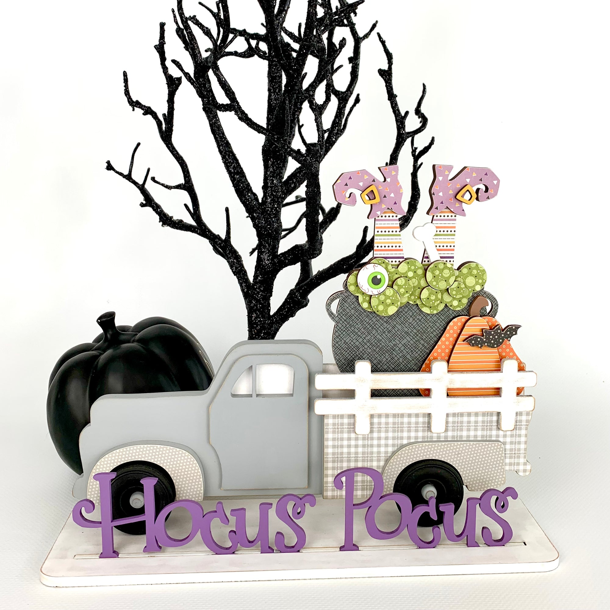 Interchangeable wood pick up truck.  Change out the wood pieces in the back of the truck.  Truck shown has a hocus pocus title with a cauldron, witches feet, and pumpkin. Wood decor Halloween craft kit.