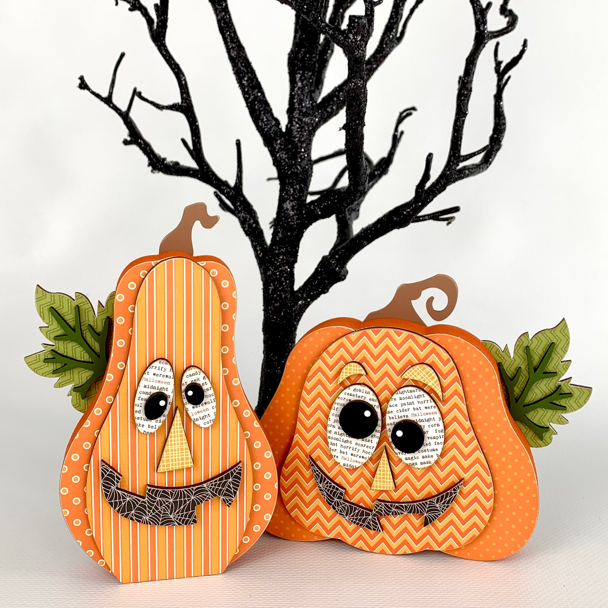 Two cute Halloween Jack-O-Lantern style pumpkins that are bright and colorful. Wood Halloween seasonal pumpkin decoration for tiered tray, shelf, or mantle.  Pumpkin wood crafting kit.