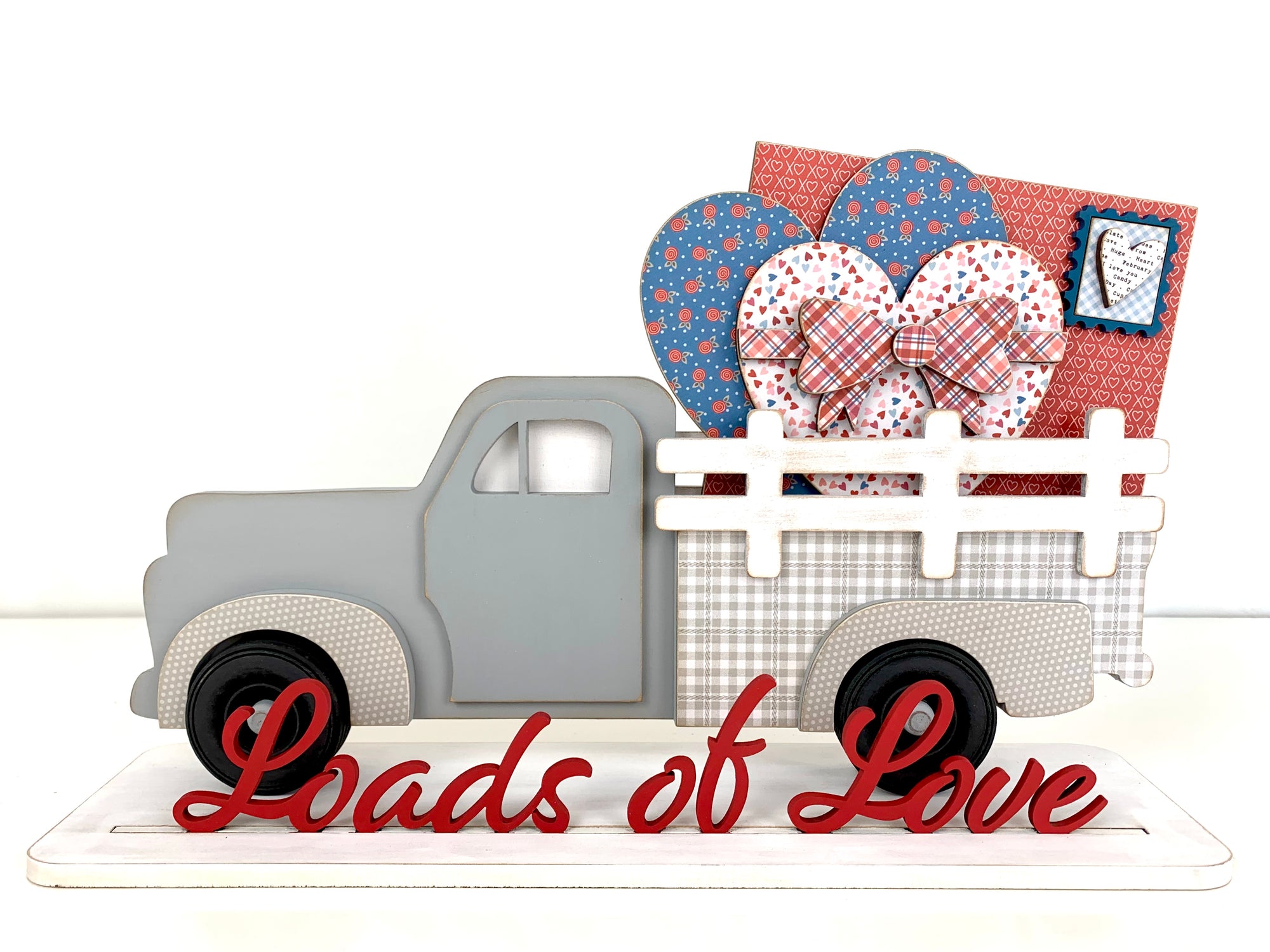Wood farmhouse truck with interchangeable bed inserts. Pick up truck with hearts and love letter in the bed of the truck. Valentine wood decor crafts. Handmade wood crafts